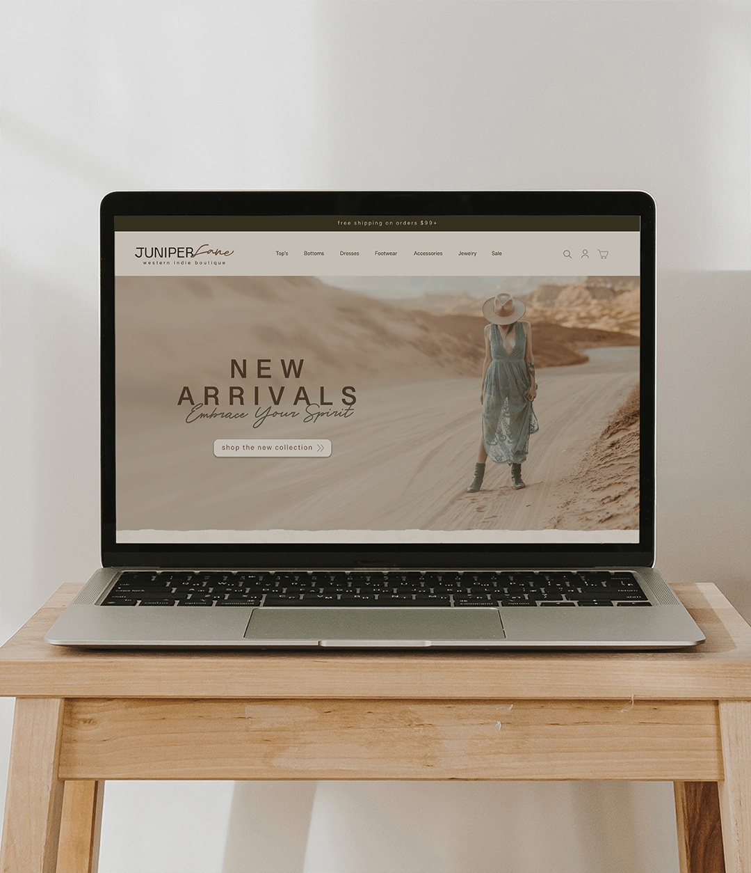 Custom e-commerce website design for a western boutique displayed on a laptop, showcasing modern responsive web design.