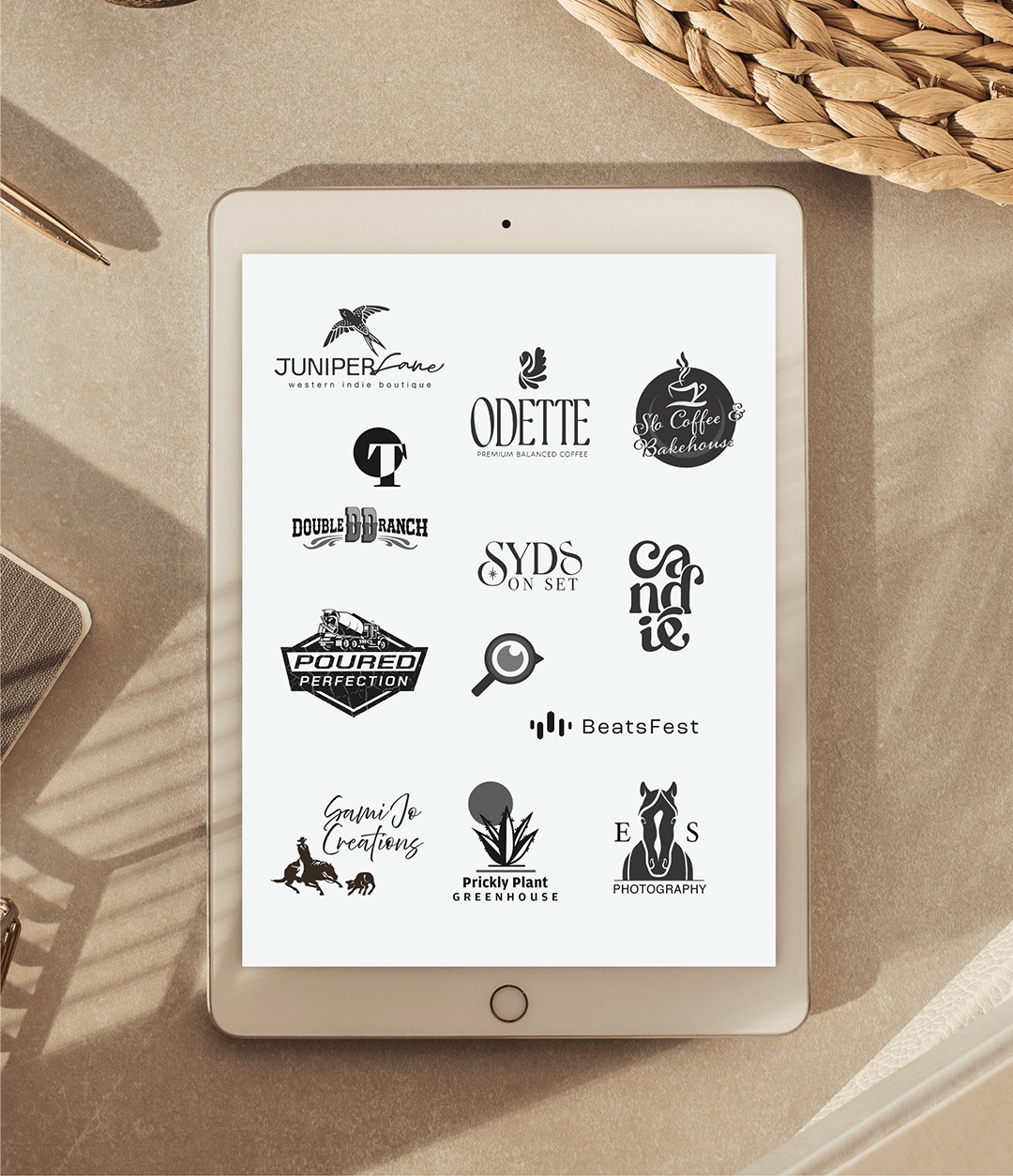 Custom-crafted, modern logos spaced evenly on a ipad.